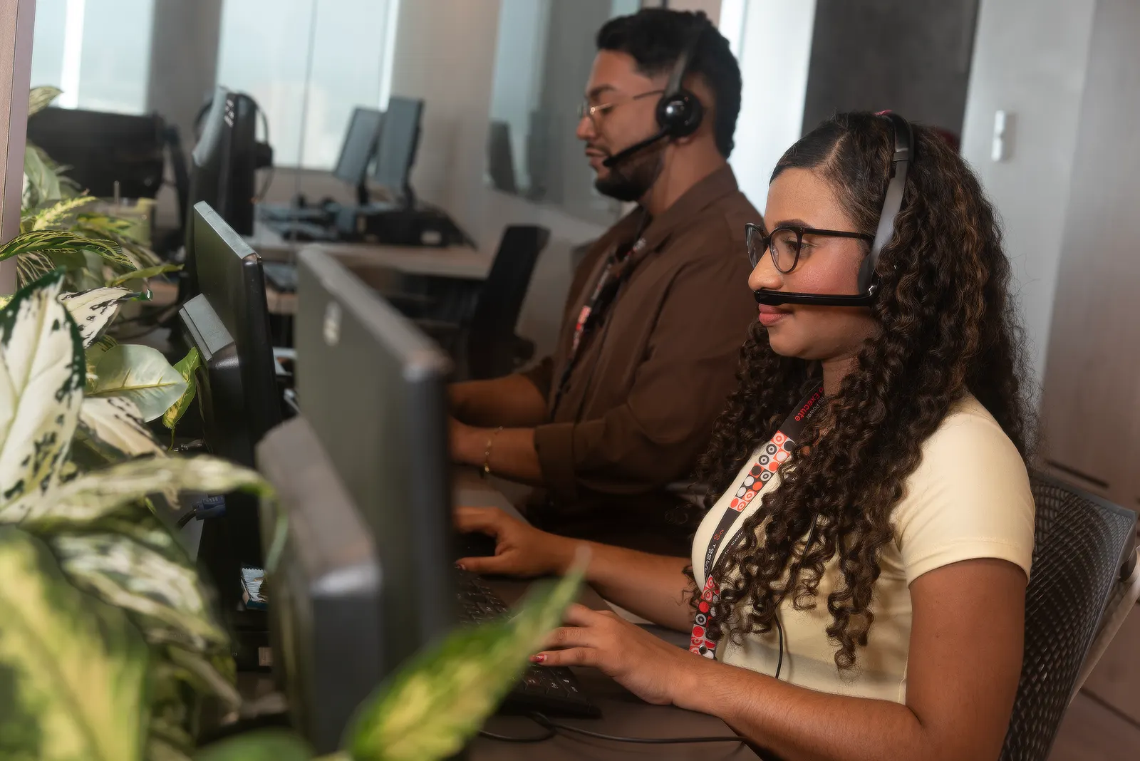 A contact centre agent managing receivables, wearing a headset